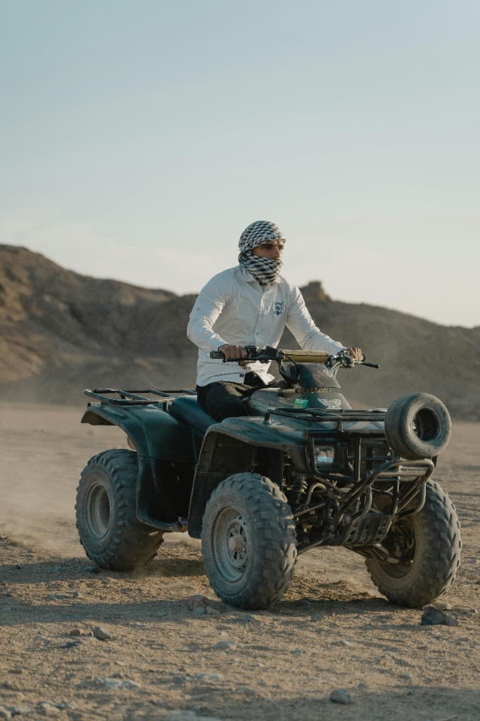 ATV rider on dirt trail